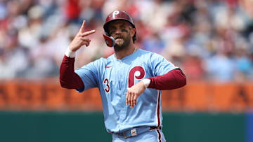 Apr 3, 2025; Philadelphia, Pennsylvania, USA; Philadelphia Phillies first base Bryce Harper (3) reacts after hitting an RBI double during the fifth inning against the Colorado Rockies at Citizens Bank Park. 