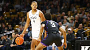 Central Florida Knights guard Keyshawn Hall (4) looks to pass as Texas Christian Horned Frogs guard Vasean Allette (3) defends at Addition Financial Arena. 