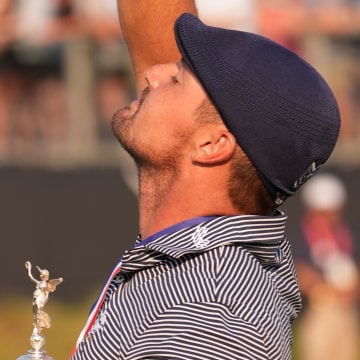 Former SMU Mustangs' golfer Bryson DeChambeau celebrates with the trophy after winning the U.S. Open golf tournament at Pinehurst, N.C.