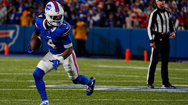 Buffalo Bills RB James Cook finds an open lane to run through during first-half action against the Kansas City Chiefs. Buffalo Bills RB James Cook finds an open lane to run through during first-half action against the Kansas City Chiefs.