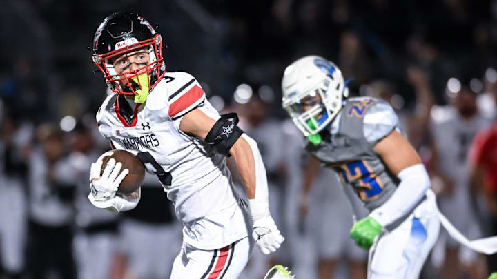 Muskego running back Jackson Niemiec (3) looks for Mukwonago defenders on a 54-yard catch-and-run touchdown during a Classic 8 Conference game Friday, October 17, 2025. Muskego running back Jackson Niemiec (3) looks for Mukwonago defenders on a 54-yard catch-and-run touchdown during a Classic 8 Conference game Friday, October 17, 2025.
