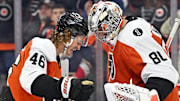 Oct 13, 2025; Philadelphia, Pennsylvania, USA; Philadelphia Flyers center Trevor Zegras (46) and goaltender Dan Vladar (80) celebrate win against the Florida Panthers at Wells Fargo Center. Mandatory Credit: Eric Hartline-Imagn Images
