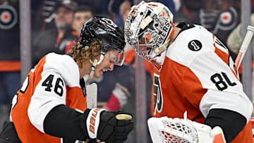 Oct 13, 2025; Philadelphia, Pennsylvania, USA; Philadelphia Flyers center Trevor Zegras (46) and goaltender Dan Vladar (80) celebrate win against the Florida Panthers at Wells Fargo Center. Mandatory Credit: Eric Hartline-Imagn Images