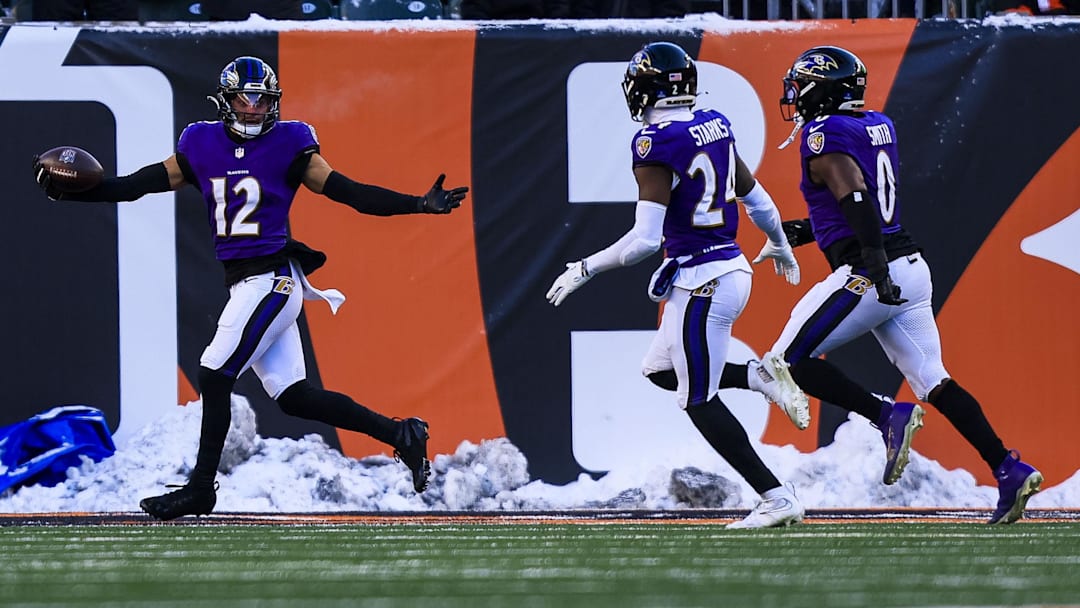Dec 14, 2025; Cincinnati, Ohio, USA; Baltimore Ravens safety Alohi Gilman (12) reacts after returning an interception for a touchdown against the Cincinnati Bengals in the second half at Paycor Stadium. Mandatory Credit: Katie Stratman-Imagn Images
