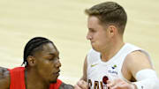 Toronto Raptors forward RJ Barrett drives against Cleveland Cavaliers guard Sam Merrill.