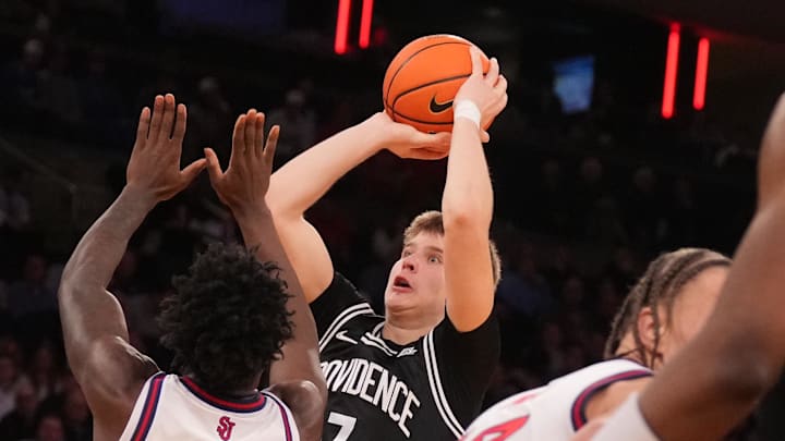 Mar 12, 2026; New York, NY, USA;  Providence Friars guard Stefan Vaaks (7) shoots over St. John's Red Storm guard Joson Sanon (3) during the second half at Madison Square Garden. Mandatory Credit: Robert Deutsch-Imagn Images