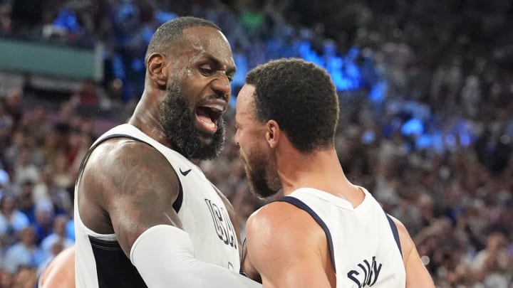 Aug 8, 2024; Paris, France; United States guard LeBron James (6) and shooting guard Stephen Curry (4) celebrate after the game against Serbia in a men's basketball semifinal game during the Paris 2024 Olympic Summer Games at Accor Arena. Mandatory Credit: Rob Schumacher-USA TODAY Sports