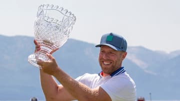 Joe Pavelski holds the championship trophy during the final round of the American Century Celebrity Championship golf tournament at Edgewood Tahoe Golf Course in Stateline, Nev., Sunday, July 13, 2025.