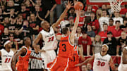 Cincinnati Bearcats James White tries to block a shot by Syracuse Orange Gerry McNamara in the second half. The Syracuse Orange defeated the Cincinnati Bearcats 77-58 at Fifth Third Arena.