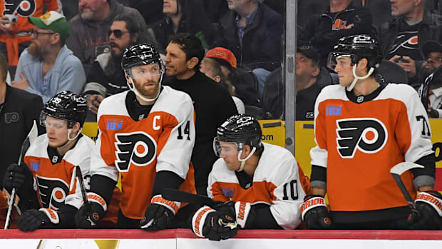 Philadelphia Flyers right wing Matvei Michkov and captain Sean Couturier