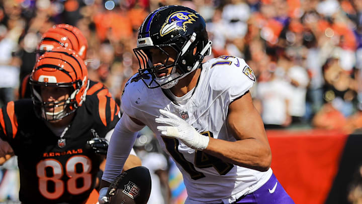 Baltimore Ravens safety Kyle Hamilton runs with the ball after an interception. Baltimore Ravens safety Kyle Hamilton runs with the ball after an interception.