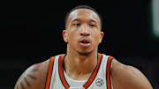 Dec 21, 2024; Coral Gables, Florida, USA; Miami Hurricanes guard Matthew Cleveland (0) high-fives with teammates after shooting a free-throw against the Mount St. Mary's Mountaineers during the second half at Watsco Center. Mandatory Credit: Sam Navarro-Imagn Images