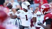 Mississippi State Bulldogs quarterback Kamario Taylor (1) passes in the third quarter against the Arkansas Razorbacks at Donald W. Reynolds Razorback Stadium. Bulldogs won 38-35.