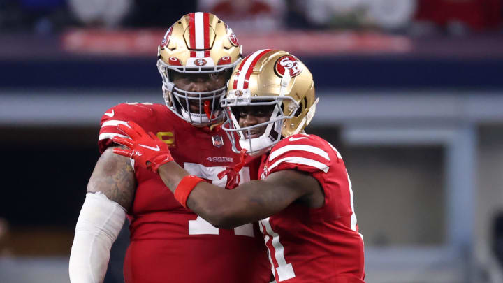 Jan 16, 2022; Arlington, Texas, USA; San Francisco 49ers wide receiver Brandon Aiyuk (11) and offensive tackle Trent Williams (71) celebrate on the field during the second half of the NFC Wild Card playoff football game against the Dallas Cowboys at AT&T Stadium. Mandatory Credit: Kevin Jairaj-USA TODAY Sports