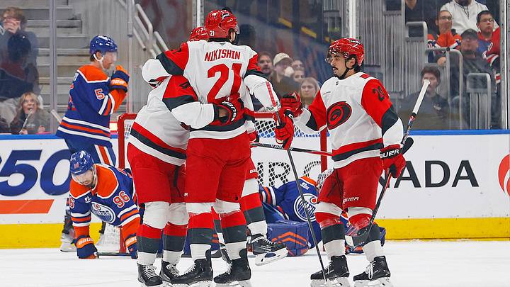 Mar 6, 2026; Edmonton, Alberta, CAN; The Carolina Hurricanes celebrate a goal scored by Hurricanes defensemen Alexander Nikishin (21) during the first period against the Edmonton Oilers at Rogers Place. Mandatory Credit: Perry Nelson-Imagn Images