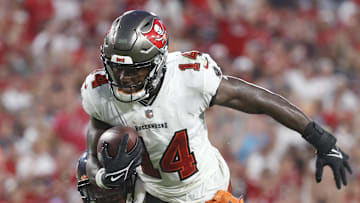 Oct 24, 2021; Tampa, Florida, USA; Tampa Bay Buccaneers wide receiver Chris Godwin (14) runs with the ball asChicago Bears free safety Eddie Jackson (4) defends during the second half at Raymond James Stadium. Mandatory Credit: Kim Klement-Imagn Images