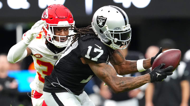 Nov 26, 2023; Paradise, Nevada, USA; Las Vegas Raiders wide receiver Davante Adams (17) makes a catch as Kansas City Chiefs cornerback L'Jarius Sneed (38) defends during the second quarter at Allegiant Stadium.