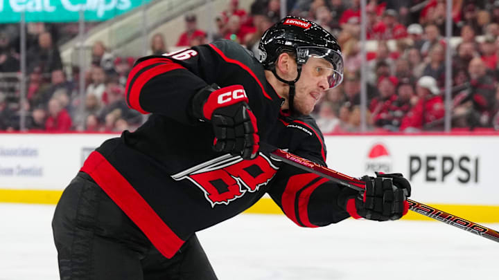 Mar 1, 2025; Raleigh, North Carolina, USA;  Carolina Hurricanes right wing Mikko Rantanen (96) takes a shot against the Edmonton Oilers during the third period at Lenovo Center. Mandatory Credit: James Guillory-Imagn Images