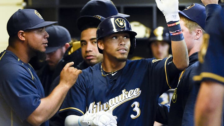 Aug 29, 2016; Milwaukee, WI, USA;  Milwaukee Brewers' Orlando Arcia is greeted in the dugout after hitting a solo home run in the seventh inning during the game against the St. Louis Cardinals at Miller Park. Mandatory Credit: Benny Sieu-Imagn Images
