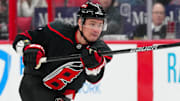 Mar 1, 2025; Raleigh, North Carolina, USA;  Carolina Hurricanes defenseman Dmitry Orlov (7) takes a shot against the Edmonton Oilers during the first period at Lenovo Center. Mandatory Credit: James Guillory-Imagn Images