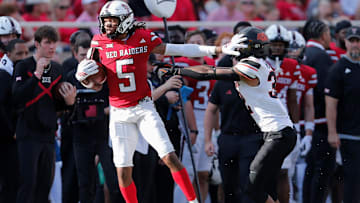 Texas Tech's Caleb Douglas stiff-arms Oklahoma State's Mordecai McDaniel in a Big 12 football game Saturday, Oct. 25, 2025, at Jones AT&T Stadium.