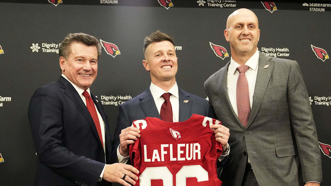 Arizona Cardinals president Michael Bidwill, new head coach Mike LaFleur, and general manager Monti Ossenfort pose for a photograph on Feb. 3, 2026, at Arizona Cardinals training center in Tempe.