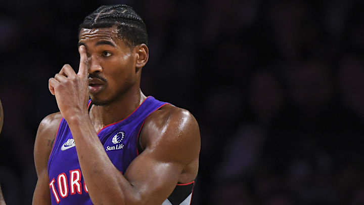 Nov 10, 2024; Los Angeles, California, USA; Los Angeles Lakers forward LeBron James (23) talks to Toronto Raptors guard Ochai Agbaji (30) during the first half at Crypto.com Arena. Mandatory Credit: Jonathan Hui-Imagn Images