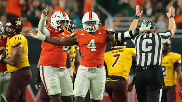 Miami Hurricanes defensive lineman Rueben Bain Jr. (4) reacts after a sack against Bethune-Cookman.