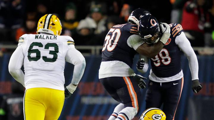 Chicago Bears defensive end Grady Jarrett (50) and defensive end Montez Sweat (98) celebrates forcing an incomplete pass by Green Bay Packers quarterback Jordan Love (10) in the fourth quarter during their wild-card playoff football game Saturday, January 10, 2026, at Soldier Field in Chicago, Illinois.