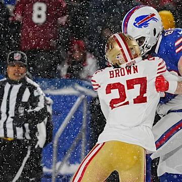Bills Dawson Knox gets tackled by a couple of 49ers including Ji'Ayir Brown during first half action of their home game against the San Francisco 49ers in Orchard Park on Dec. 1, 2024.
