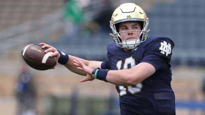 Notre Dame quarterback Riley Leonard (13) who is hurt, dresses and throws some pre-game passes with fellow quarterbacks Saturday, April 20, 2024, at the annual Notre Dame Blue-Gold spring football game at Notre Dame Stadium in South Bend.