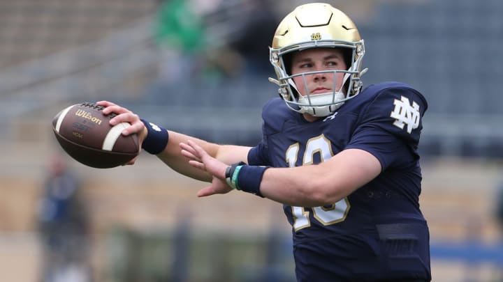 Notre Dame quarterback Riley Leonard (13) who is hurt, dresses and throws some pre-game passes with fellow quarterbacks Saturday, April 20, 2024, at the annual Notre Dame Blue-Gold spring football game at Notre Dame Stadium in South Bend.