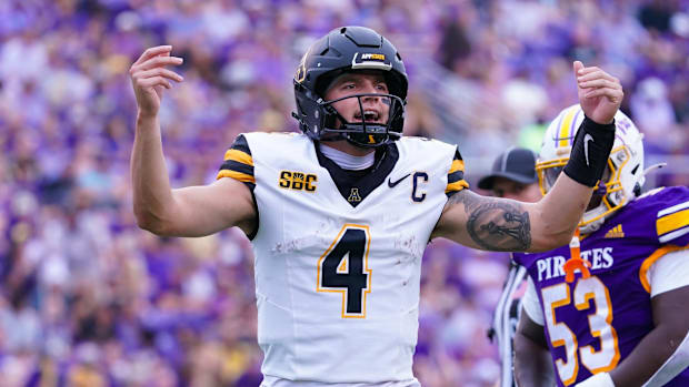 Appalachian State Mountaineers quarterback Joey Aguilar (4) reacts after scoring a touchdown.