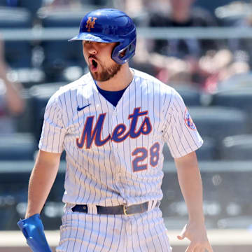Jun 20, 2022; New York City, New York, USA; New York Mets designated hitter J.D. Davis (28) reacts after scoring against the Miami Marlins on a sacrifice fly by third baseman Eduardo Escobar (not pictured) during the fourth inning at Citi Field. Mandatory Credit: Brad Penner-Imagn Images