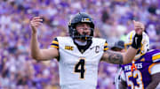 Sep 14, 2024; Greenville, North Carolina, USA;  Appalachian State Mountaineers quarterback Joey Aguilar (4) reacts after the touchdown against the East Carolina Pirates during the first half at Dowdy-Ficklen Stadium. Mandatory Credit: James Guillory-Imagn Images