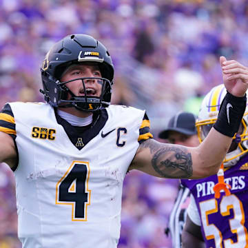 Sep 14, 2024; Greenville, North Carolina, USA;  Appalachian State Mountaineers quarterback Joey Aguilar (4) reacts after the touchdown against the East Carolina Pirates during the first half at Dowdy-Ficklen Stadium. Mandatory Credit: James Guillory-Imagn Images