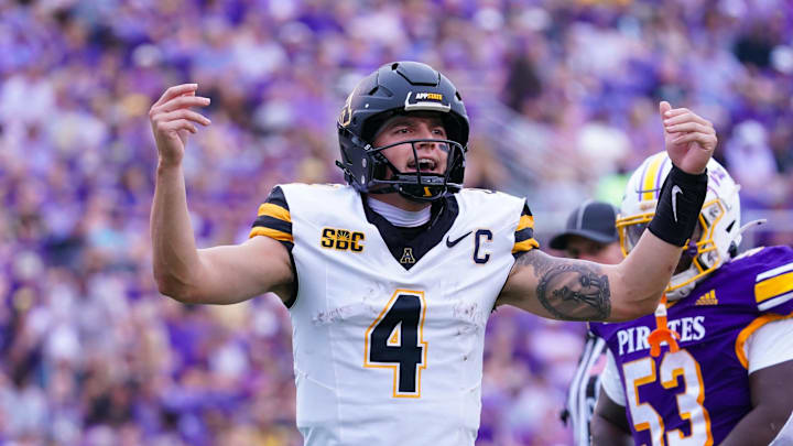 Sep 14, 2024; Greenville, North Carolina, USA;  Appalachian State Mountaineers quarterback Joey Aguilar (4) reacts after the touchdown against the East Carolina Pirates during the first half at Dowdy-Ficklen Stadium. Mandatory Credit: James Guillory-Imagn Images