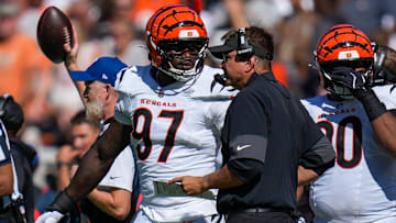 Cincinnati Bengals defensive end Shemar Stewart (97) talks with defensive coordinator Al Golden in the fourth quarter of the NFL Week 1 game between the Cleveland Browns and the Cincinnati Bengals at Huntington Bank Field in Cleveland on Sunday, Sept. 7, 2025. The Bengals begin the season with a 17-16 win over the Browns.