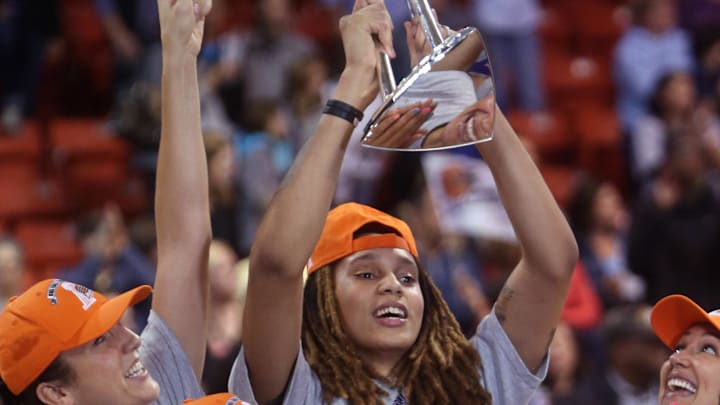 Sep 12, 2014; Chicago, IL, USA; Phoenix Mercury center Brittney Griner (rear) hoists the WNBA championship trophy after defeating the Chicago Sky in game three of the 2014 WNBA Finals at UIC Pavilion. Mandatory Credit: Jerry Lai-Imagn Images