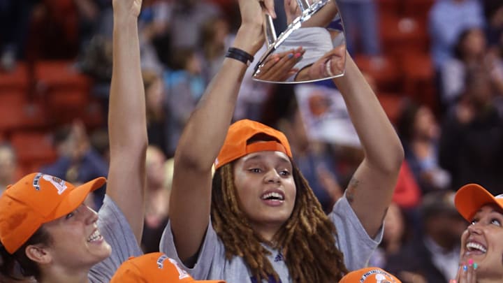 Sep 12, 2014; Chicago, IL, USA; Phoenix Mercury center Brittney Griner (rear) hoists the WNBA championship trophy after defeating the Chicago Sky in game three of the 2014 WNBA Finals at UIC Pavilion. Mandatory Credit: Jerry Lai-Imagn Images