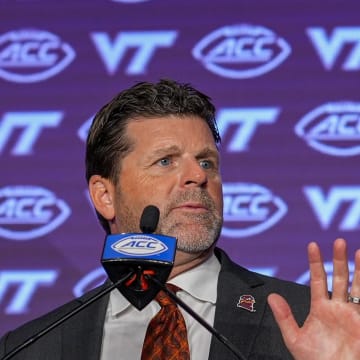 Jul 23, 2024; Charlotte, NC, USA; Virginia Tech head coach Brent Pry answers questions from the media during the ACC Kickoff at Hilton Charlotte Uptown. Mandatory Credit: Jim Dedmon-USA TODAY Sports