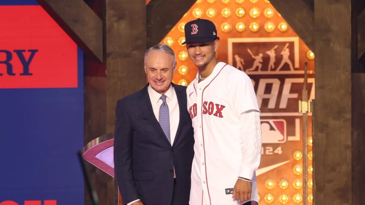 Jul 14, 2024; Ft. Worth, TX, USA;  MLB Commissioner Rob Manfred takes a photo with Braden Montgomery after he was drafted by the Boston Red Sox with the twelfth pick during the first round of the MLB Draft at Cowtown Coliseum. Mandatory Credit: Kevin Jairaj-USA TODAY Sports