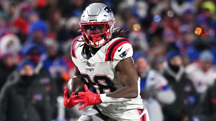 Dec 22, 2024; Orchard Park, New York, USA; New England Patriots running back Rhamondre Stevenson (38) carries the ball against the Buffalo Bills in the third quarter at Highmark Stadium. Mandatory Credit: Mark Konezny-Imagn Images