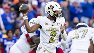 Nov 23, 2024; Kansas City, Missouri, USA;  Colorado quarterback Shedeur Sanders (2) passes the ball during the 2nd quarter between the Kansas Jayhawks and the Colorado Buffaloes at GEHA Field at Arrowhead Stadium. 