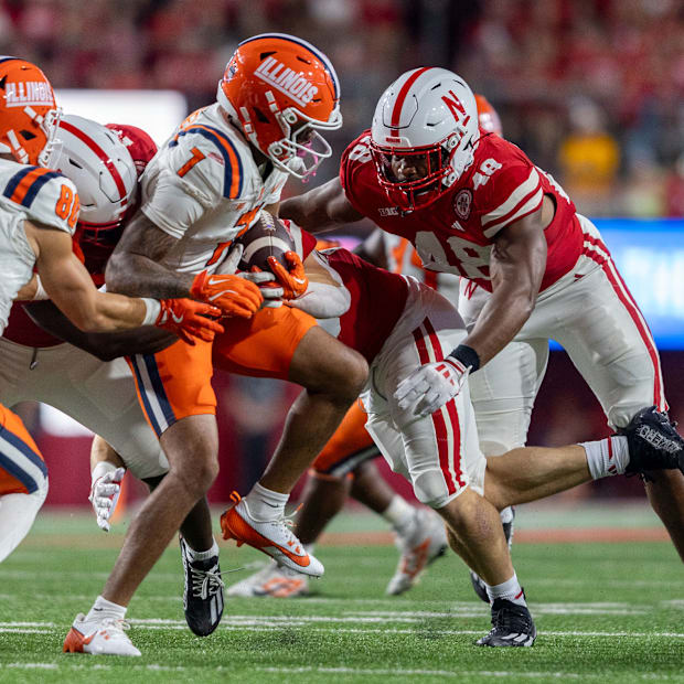 Illinois return man Kenari Wilcher is brought down by Nebraska's Vincent Shavers, Jr. in Memorial Stadium.