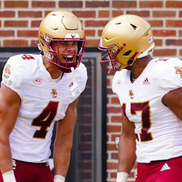 Sep 14, 2024; Columbia, Missouri, USA; Boston College Eagles wide receiver Reed Harris (4) celebrates with tight end Jeremiah Franklin (17) after scoring against the Missouri Tigers during the first half at Faurot Field at Memorial Stadium. Mandatory Credit: Denny Medley-Imagn Images