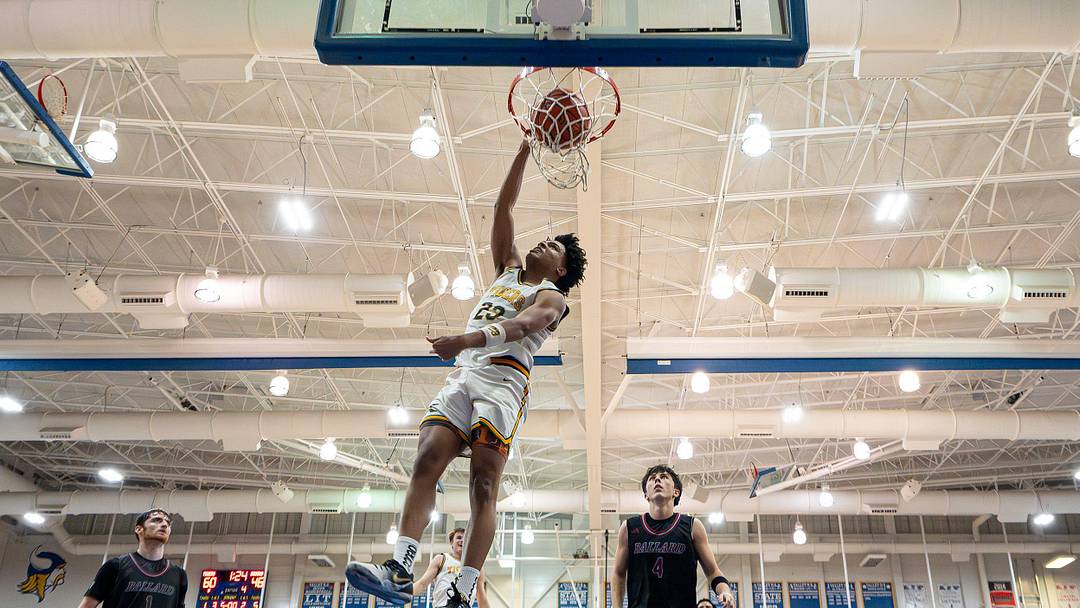 St. Xavier's Jeremiah Jackson (23) dunks the ball during second half action as the St. Xavier Tigers battle the Ballard Bruins in the KHSAA 7th Region boys basketball final at Valley High School on March 9, 2026, in Louisville, Ky. Jackson showed out in game one of the Kentucky-Indiana All-Stars series, scoring 24 points and snagging six rebounds.
