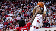 Indiana Hoosiers forward Mackenzie Mgbako (21) shoots the ball while Rutgers Scarlet Knights guard Jeremiah Williams (25)  defends in the first half at Simon Skjodt Assembly Hall.