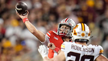 Ohio State Buckeyes quarterback Julian Sayin (10) throws over Minnesota Golden Gophers linebacker Jeff Roberson (20) during the first half of the NCAA football game at Ohio Stadium in Columbus on Oct. 4, 2025.