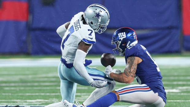 Dallas Cowboys cornerback Trevon Diggs (7) forces a fumble by New York Giants wide receiver Isaiah Hodgins 